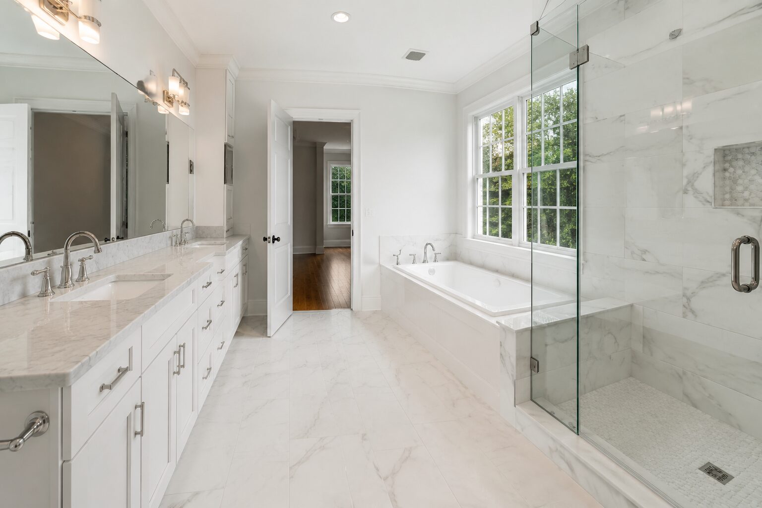 Bathroom remodel reference — white marble, double vanity and glass shower